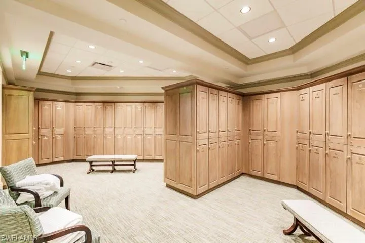 Building lobby featuring ornamental molding and recessed lighting