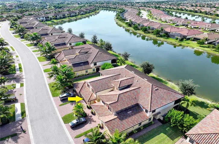 Aerial perspective of suburban area with a large body of water