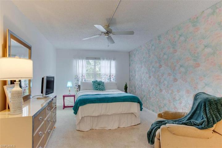 Large bedroom with a very spacious walk in closet   Bright and sunny view of greenery