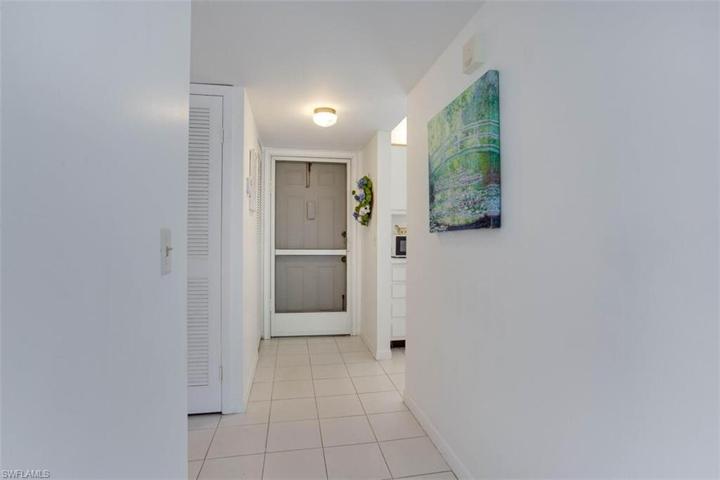 Tiled entry, kitchen and bath