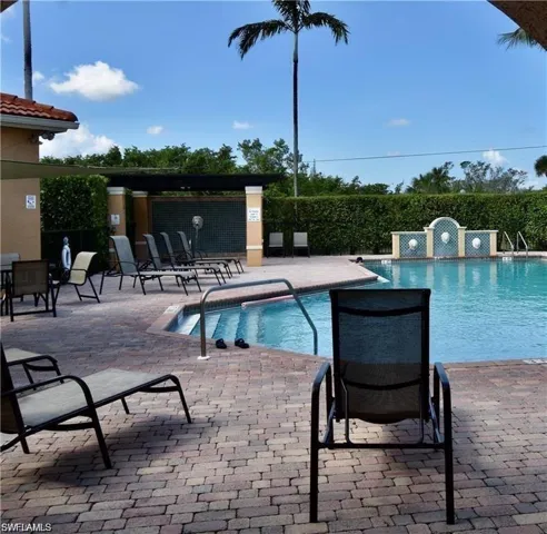 Community pool featuring a patio area