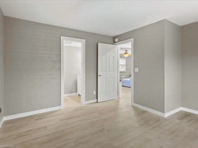 Spare room featuring light wood-style floors and ceiling fan