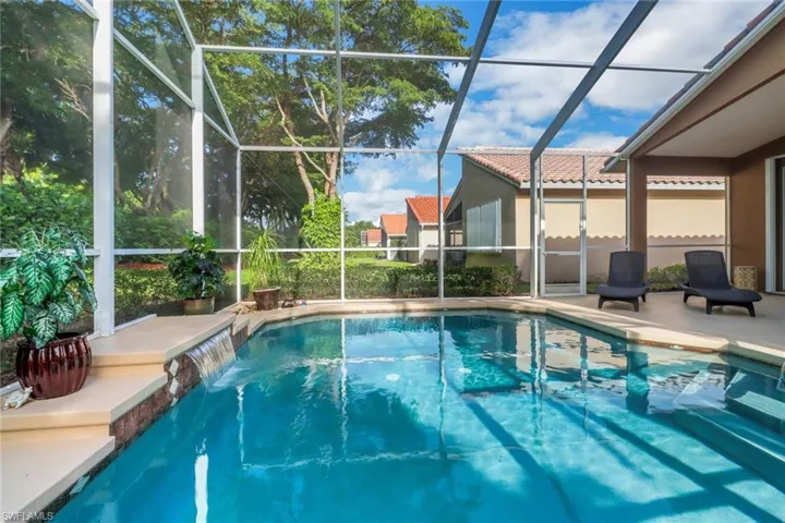 Swimming pool with a lanai and a patio