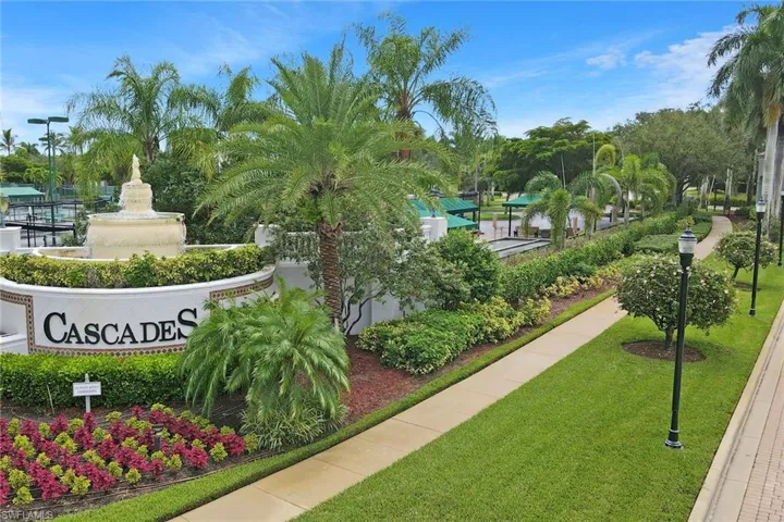 View of home's community with a lawn
