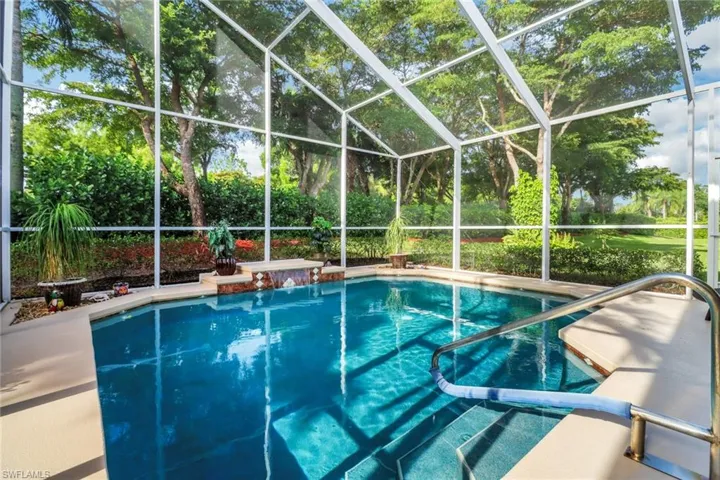 Swimming pool with glass enclosure