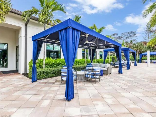 View of patio with an outdoor hangout area
