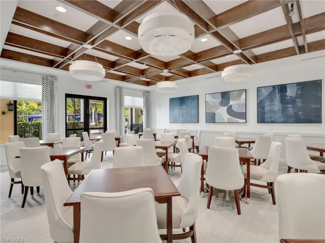 Dining area with coffered ceiling, beamed ceiling, and recessed lighting