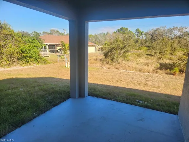 View of yard with a patio area