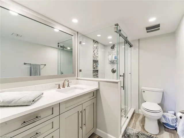 Primary bath, tall vanity and an updated shower
