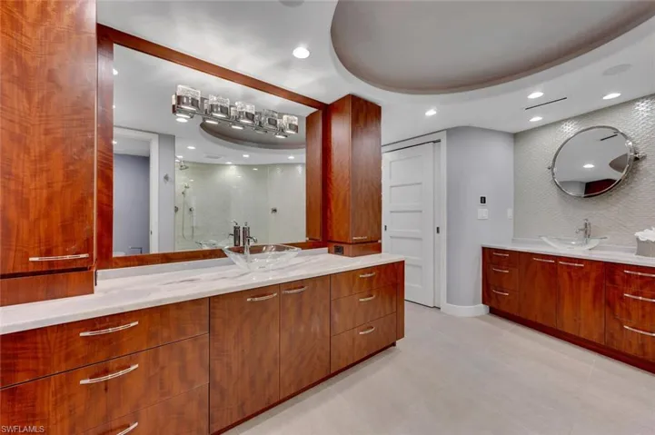 Bathroom featuring walk in shower and vanity