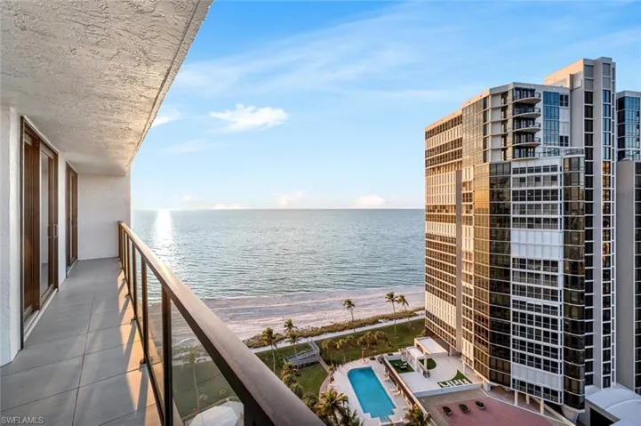 Balcony with a beach view and a water view