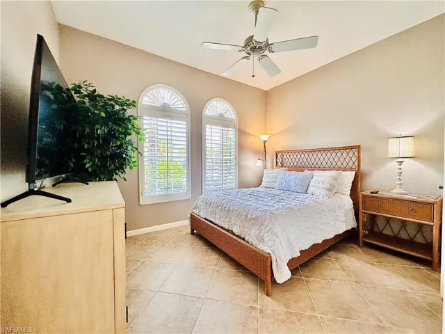Tiled bedroom with ceiling fan