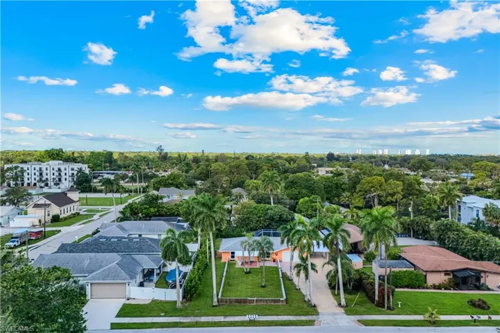 Aerial perspective of a residential neighborhood featuring established properties and mature landscaping