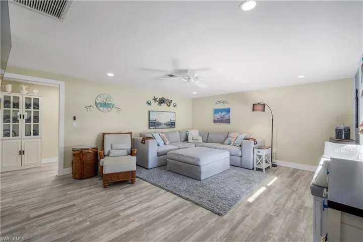 Recessed lights, vinyl flooring, great decor