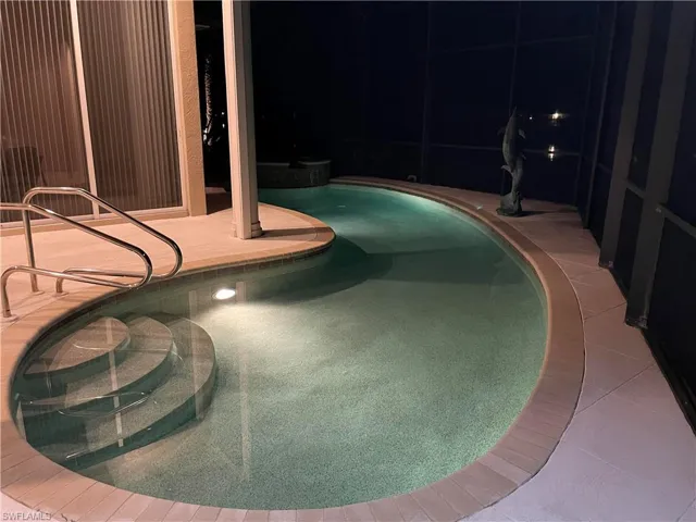 View of pool at twilight