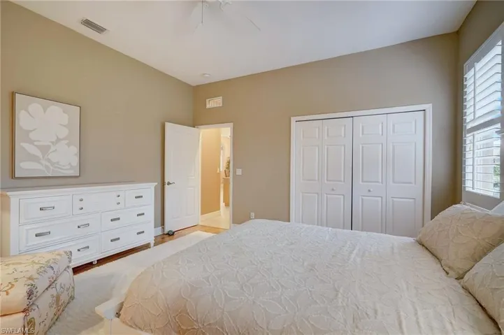 Bedroom #3 featuring a closet, light hardwood / wood-style floors, and ceiling fan