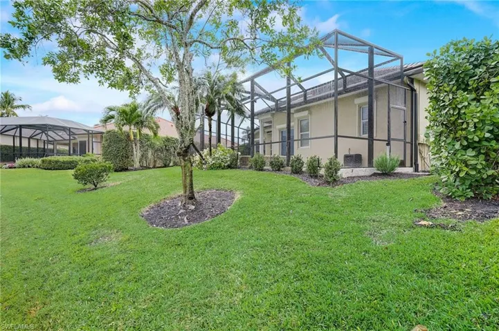 View of yard with a lanai