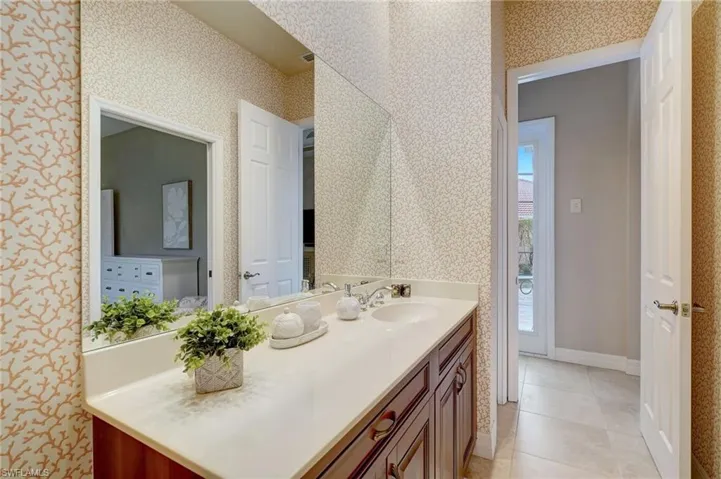 Bathroom with tile patterned flooring and vanity