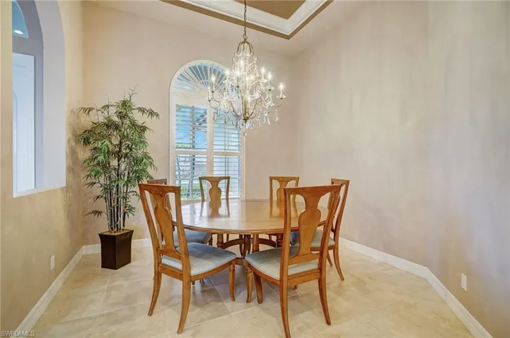 Dining area featuring a notable chandelier and ornamental molding