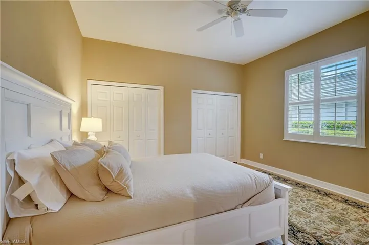 En Suite #2 featuring ceiling fan and two closets