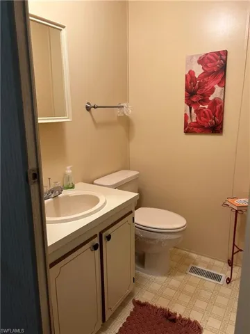 Bathroom with vanity and toilet