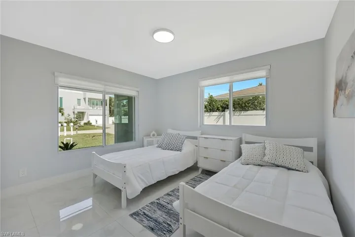 Bedroom with multiple windows