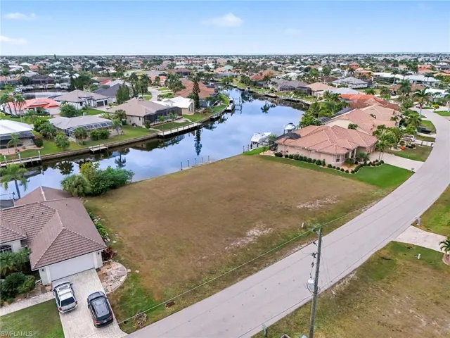 Aerial view of residential area with a nearby body of water