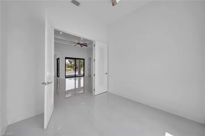 Spare room with ceiling fan and recessed lighting