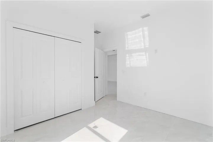 Unfurnished bedroom with a closet