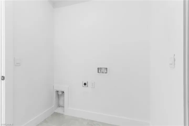 Laundry room featuring hookup for an electric dryer and hookup for a washing machine