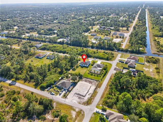 View of property location featuring nearby suburban area and a nearby body of water