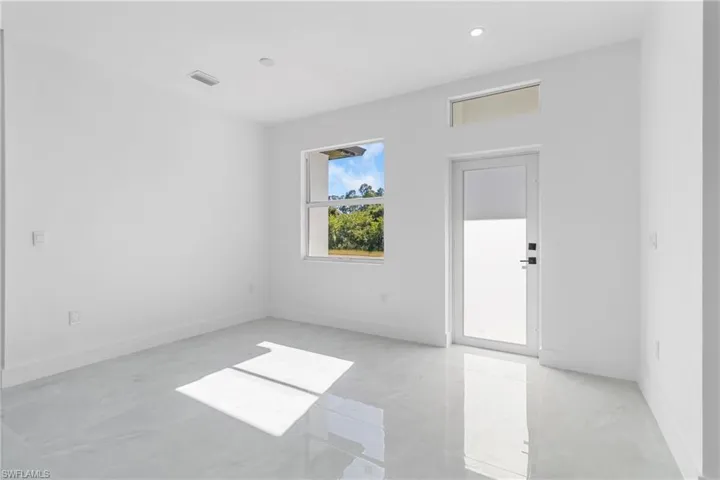 Unfurnished room with baseboards and recessed lighting
