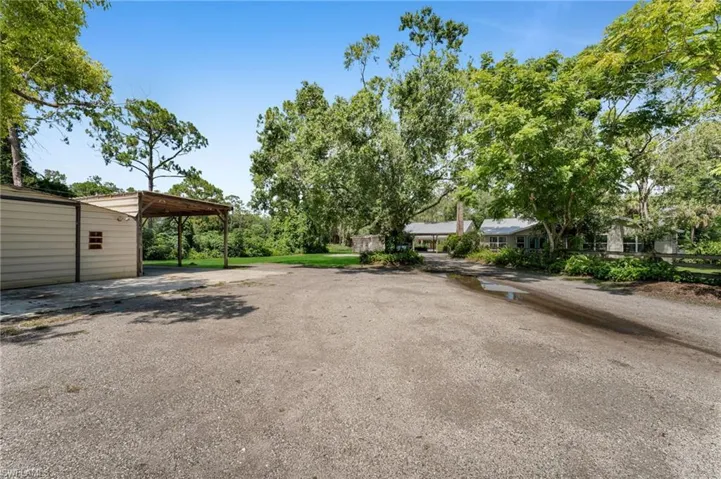 Driveway and parking galore with crushed pavement drive
