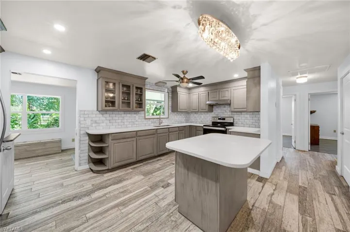 Remodeled Kitchen with Newer Cabinets, Granite counters,  Window, Floors, appliances ~ Hall to guest bathroom and guest bedrooms and Den.