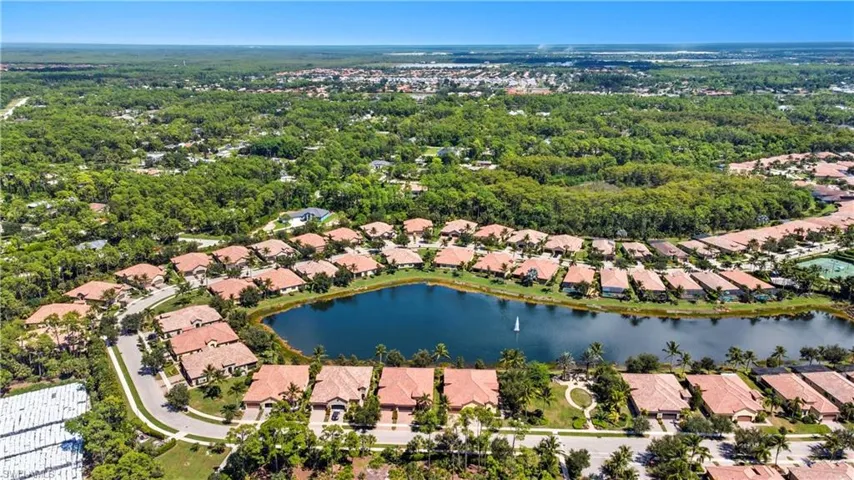 Aerial overview of property's location with a nearby body of water and nearby suburban area