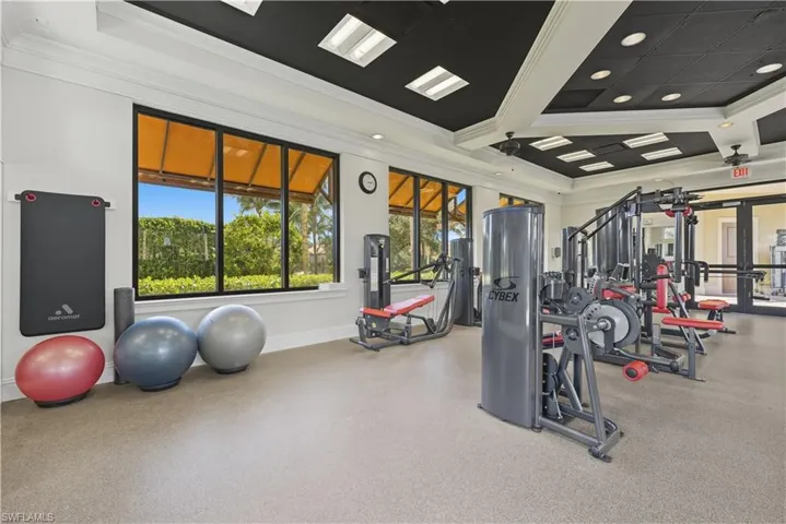 Workout area featuring crown molding, recessed lighting, and coffered ceiling