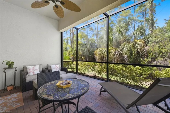 Sunroom with a ceiling fan