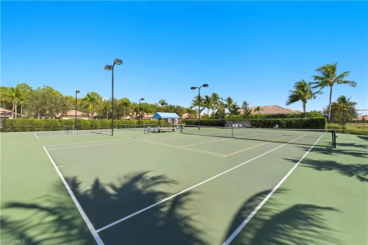 View of tennis court featuring community basketball court