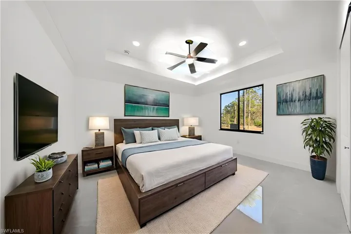 Bedroom featuring a ceiling fan, recessed lighting, and concrete flooring