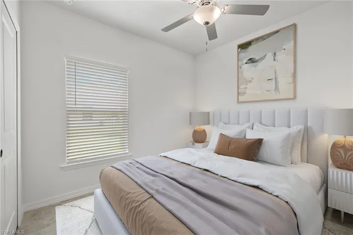 Bedroom featuring wood-type flooring and ceiling fan