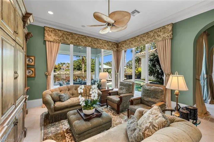 The family room has impact sliders that open out to the lanai, pool and expansive views.