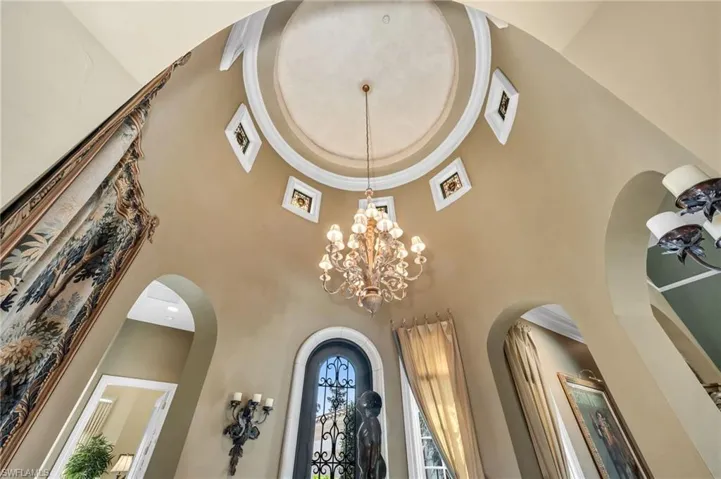 The main entry into the turret foyer is a stunning 23 feet tall, with stained glass inserts that can be removed.