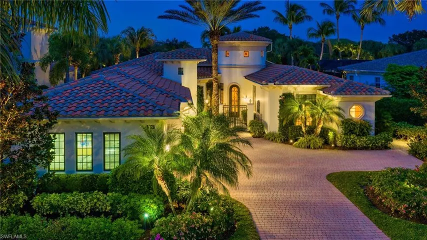 This residence comes to life in the evening, with added landscape lighting around the residence.