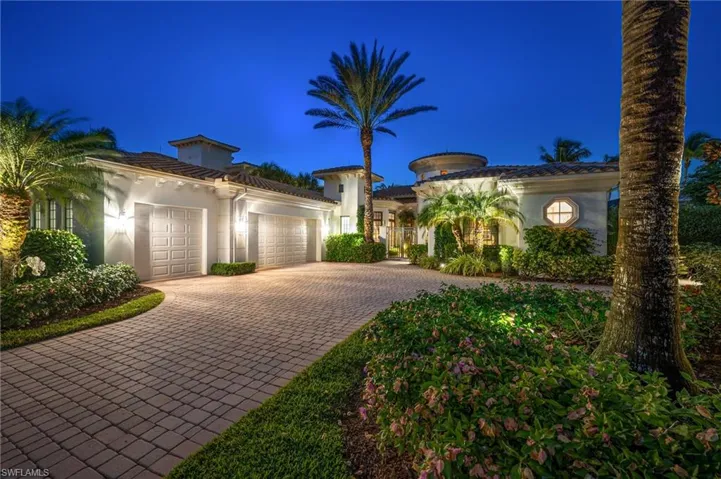 This residence comes to life in the evening, with added landscape lighting around the residence.