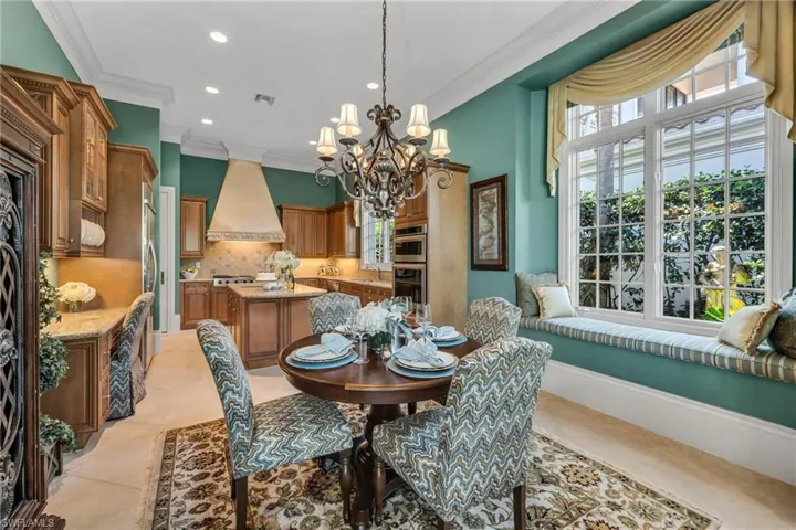 Cozy morning room just off the kitchen, with window seat that could serve as a banquette.