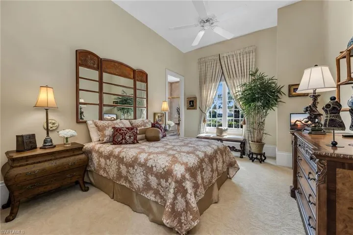 Guest Bedroom 3 is expansive and have views out to the lake and golf course across the street.