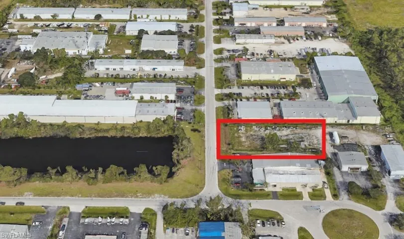 Aerial view of property and surrounding area with property parcel outlined