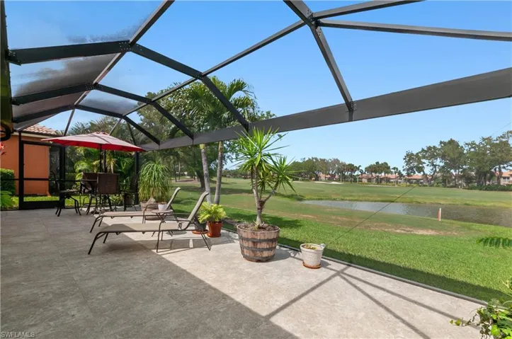 Large lanai featuring tile flooring, wide view screened enclosure.