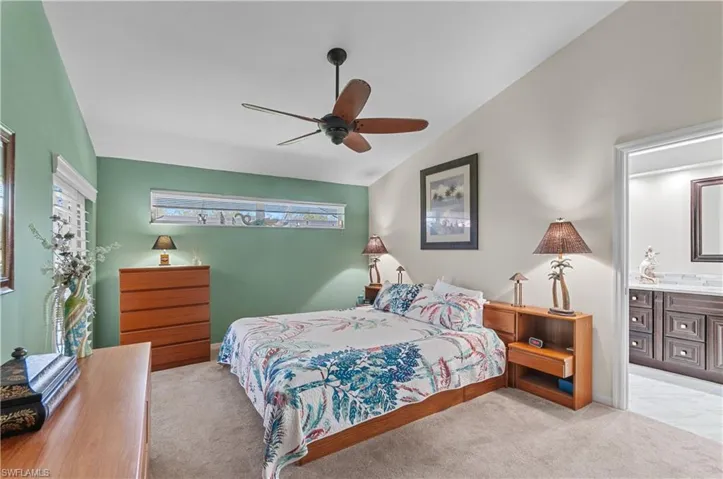 Master bedroom, ceiling fan, and ensuite bathroom
