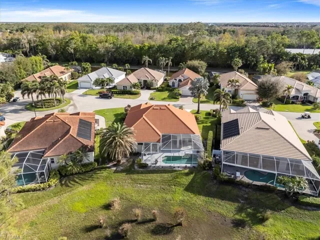 Drone / aerial view featuring a residential view and a wooded view